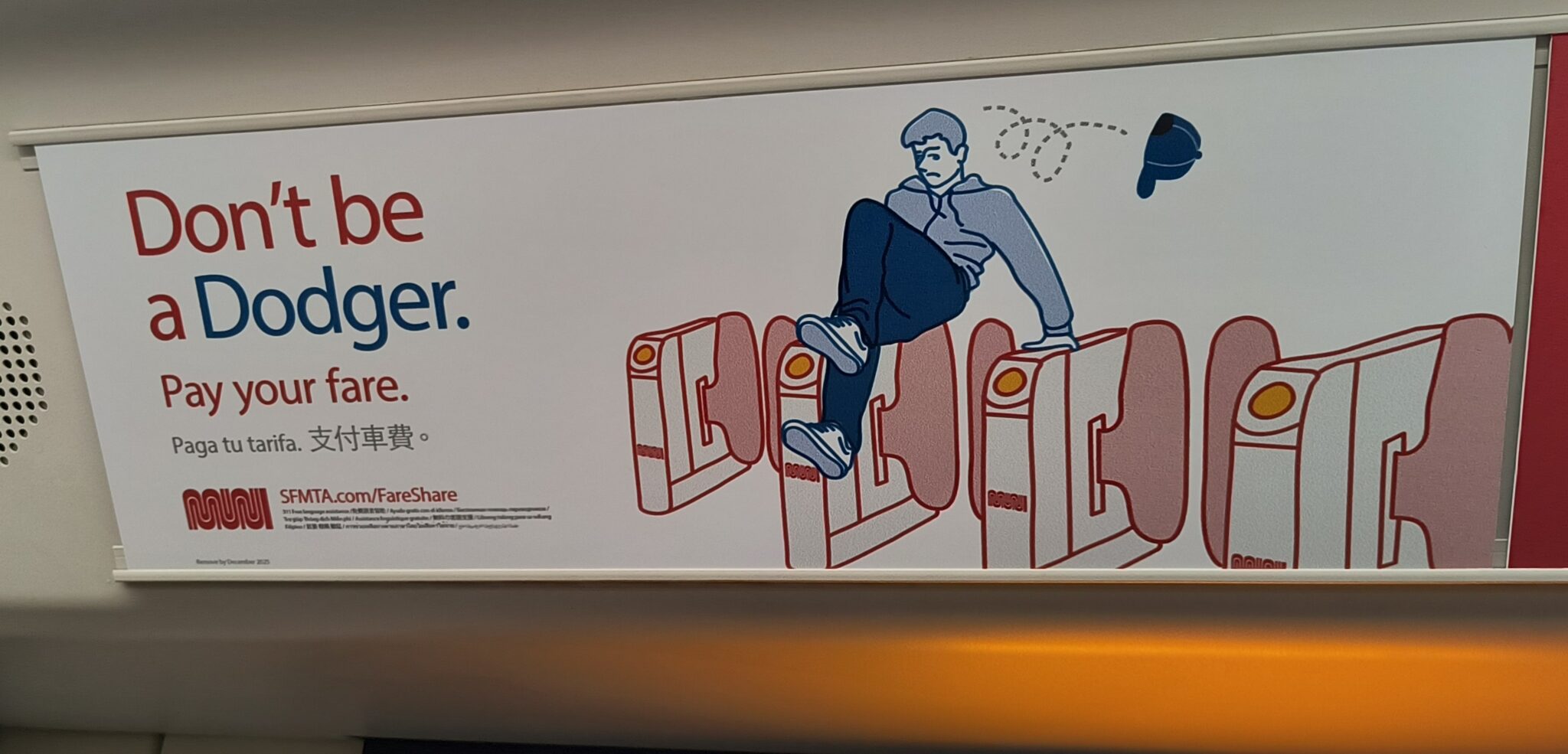  Ad on train of a blue man jumping over transit fare gates with his hat falling off. Text reads: Don't be a dodger. Pay your fare.